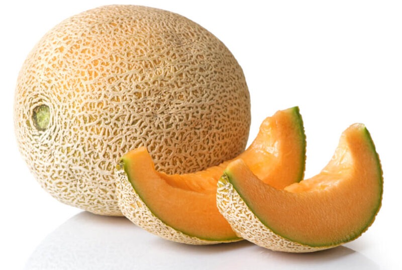 Whole and sliced sweet cantelope fruit